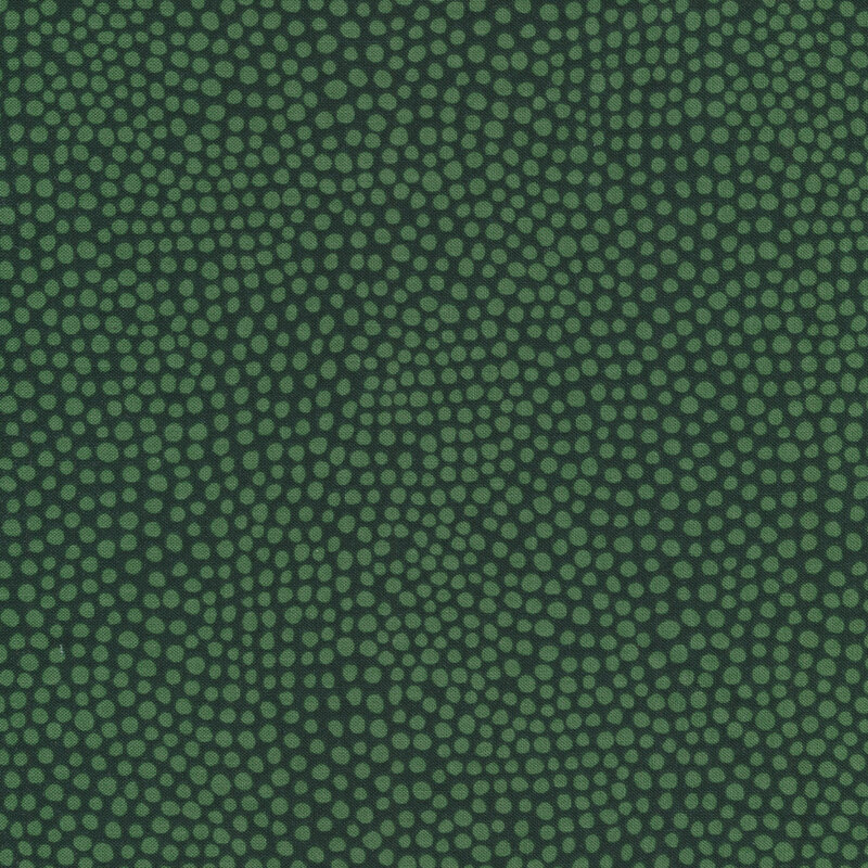 Dark green fabric with small green spots all over