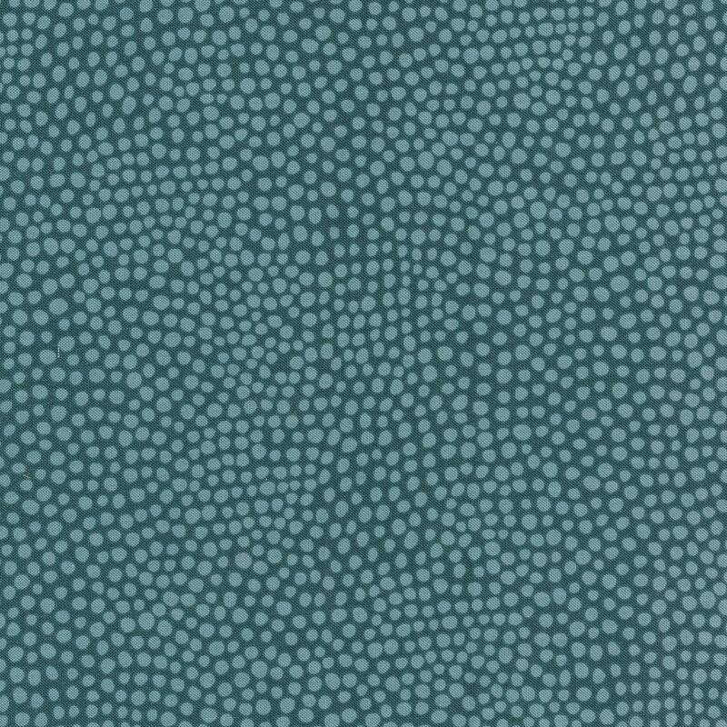 Teal fabric with small light teal spots all over