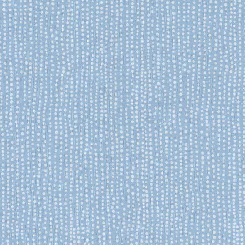 Light blue tonal fabric with irregular lines of small white dots close together
