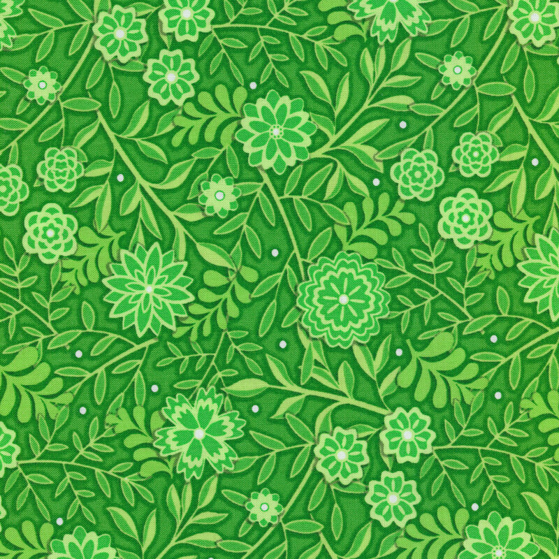 Green Christmas fabric with florals, leaves, vines, and small white polka dots