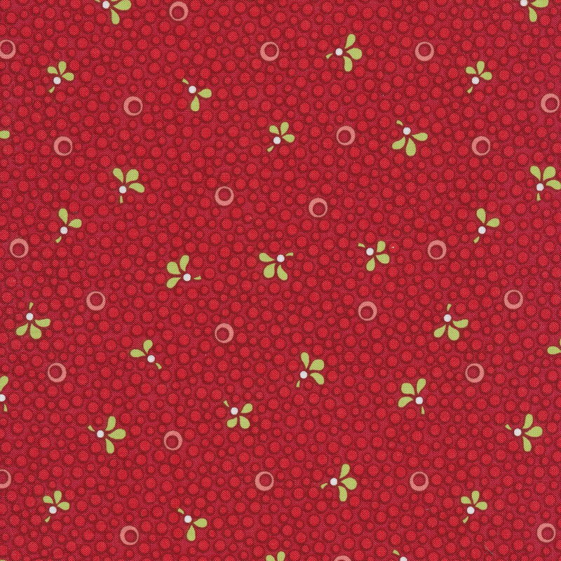 Red Christmas fabric with red spots and small green leaves
