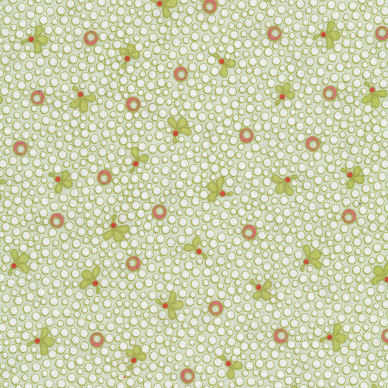Light green Christmas fabric with white spots and small green leaves