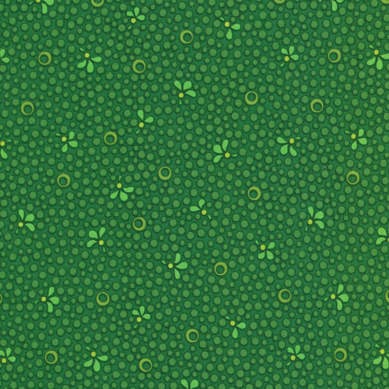 Dark green Christmas fabric with green spots and small light green leaves