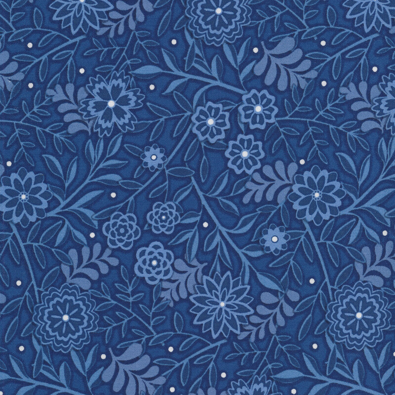 Tonal fabric with medium blue vines and flowers with a dark blue background