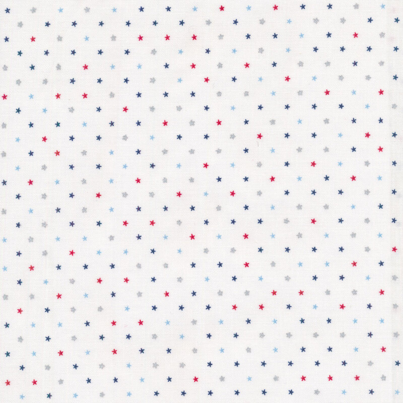 Red and blue metallic patriotic stars tossed on a white background