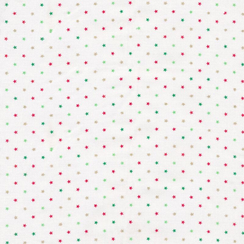 red, green and gold metallic stars tossed on a white background