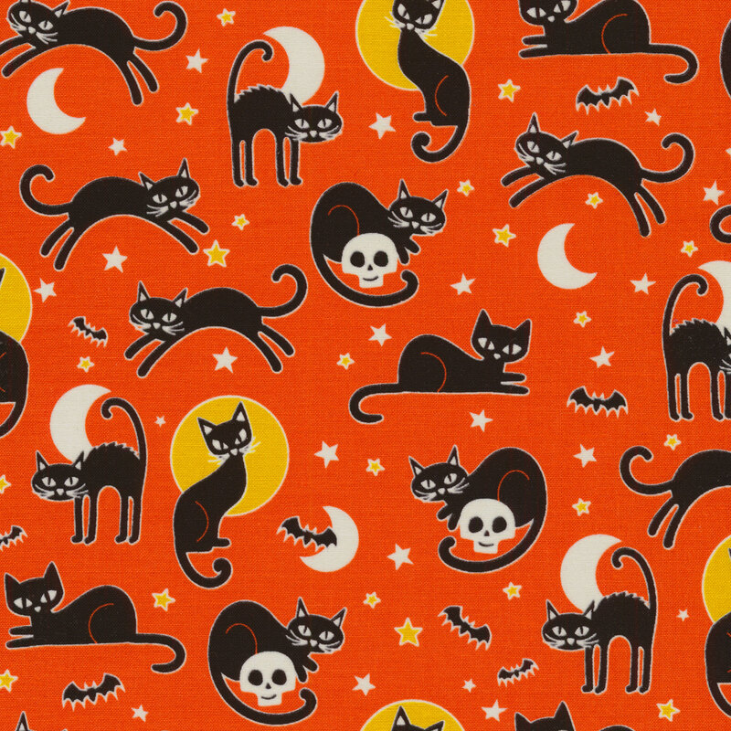 scan of fabric with black cats with small bats, stars, and moons on a bright orange background