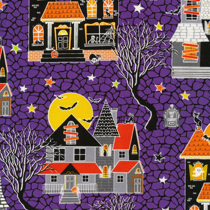 scan of fabric with haunted houses, stars, bats, old trees, and headstones