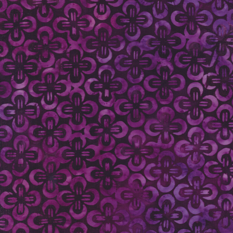 magenta and violet scalloped repeating print on a dark purple background