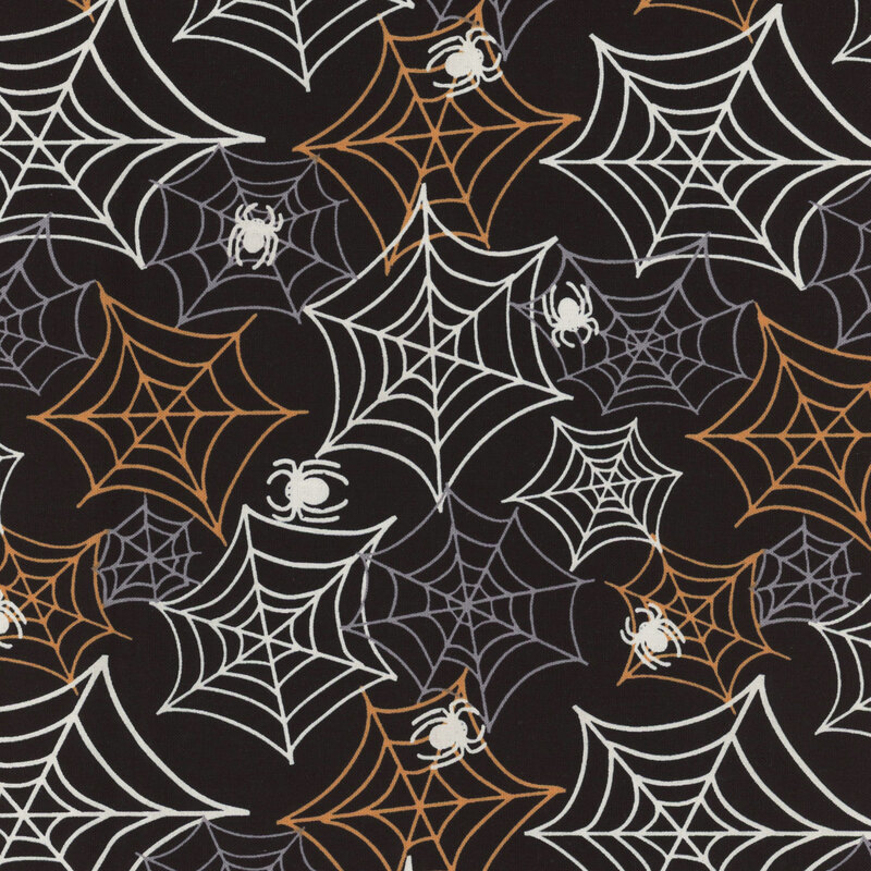 Solid black fabric with orange, gray, and white spider webs and spiders all over