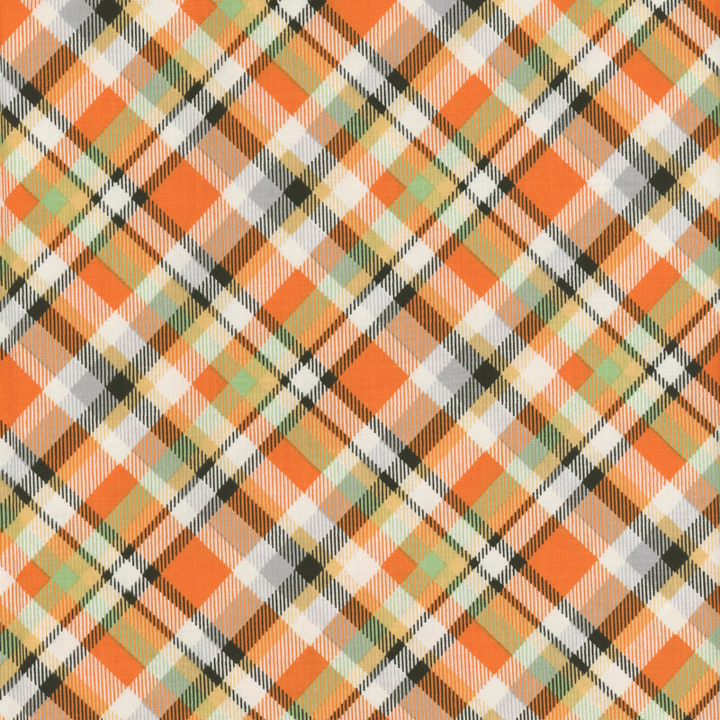 Orange, black, and green fabric with a plaid design