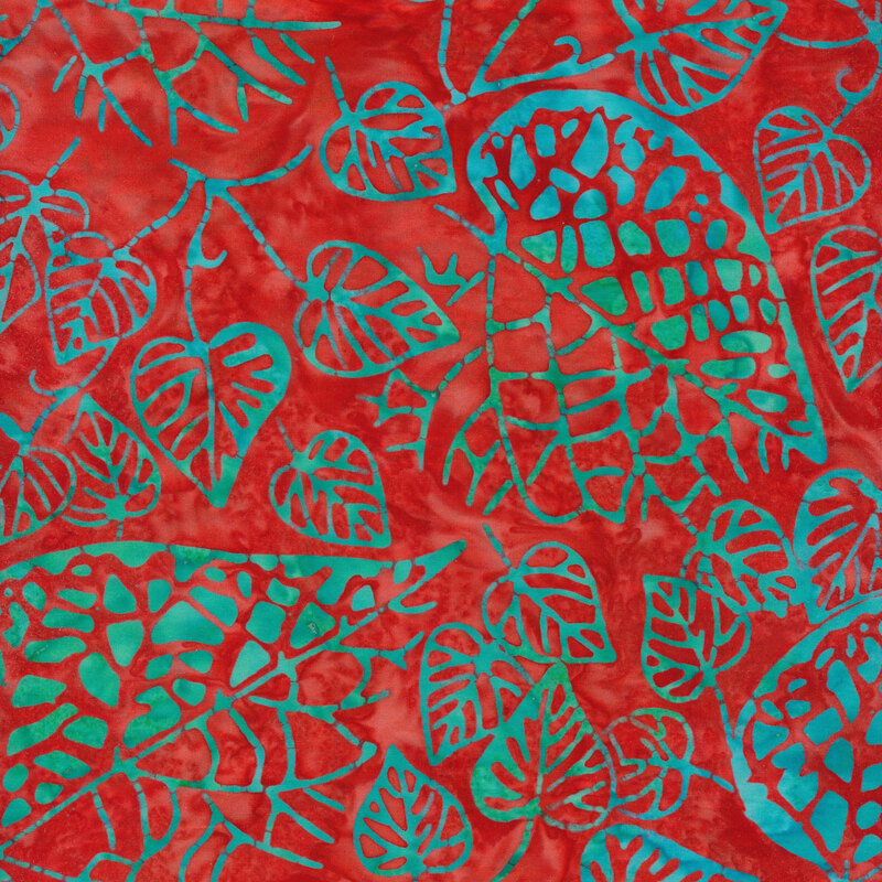 Red fabric with blue and green variegated leaf patterns all over