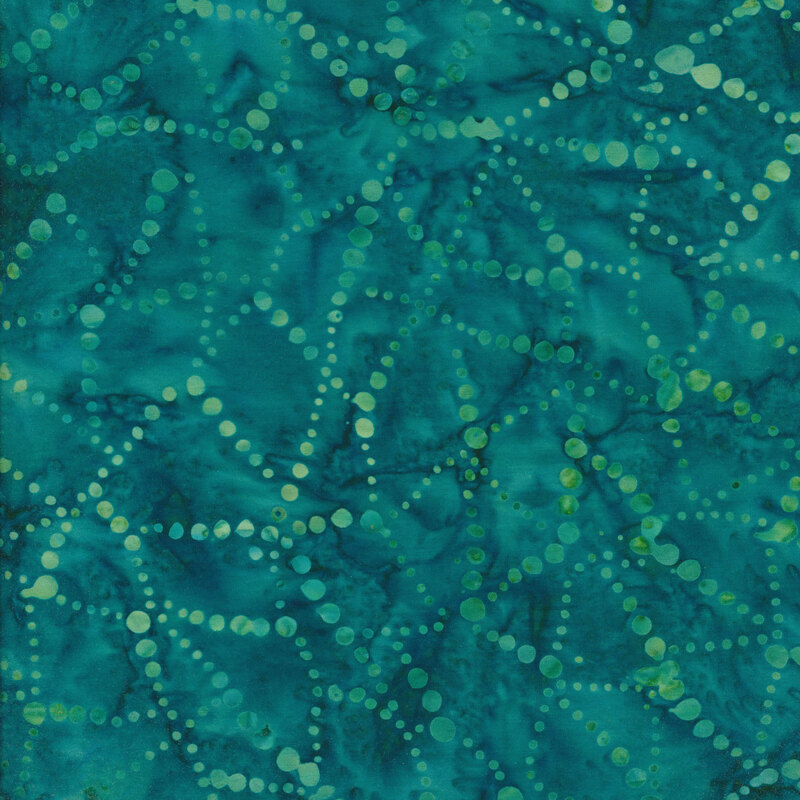 Mottled teal fabric with light green dots that form lines that intersect in a web