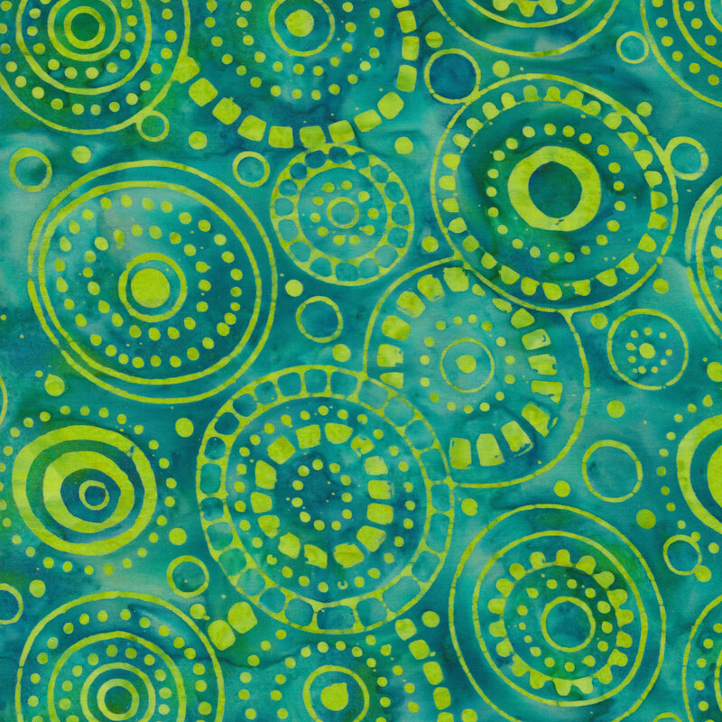 mottled blue fabric with lime green rings and dots that overlap
