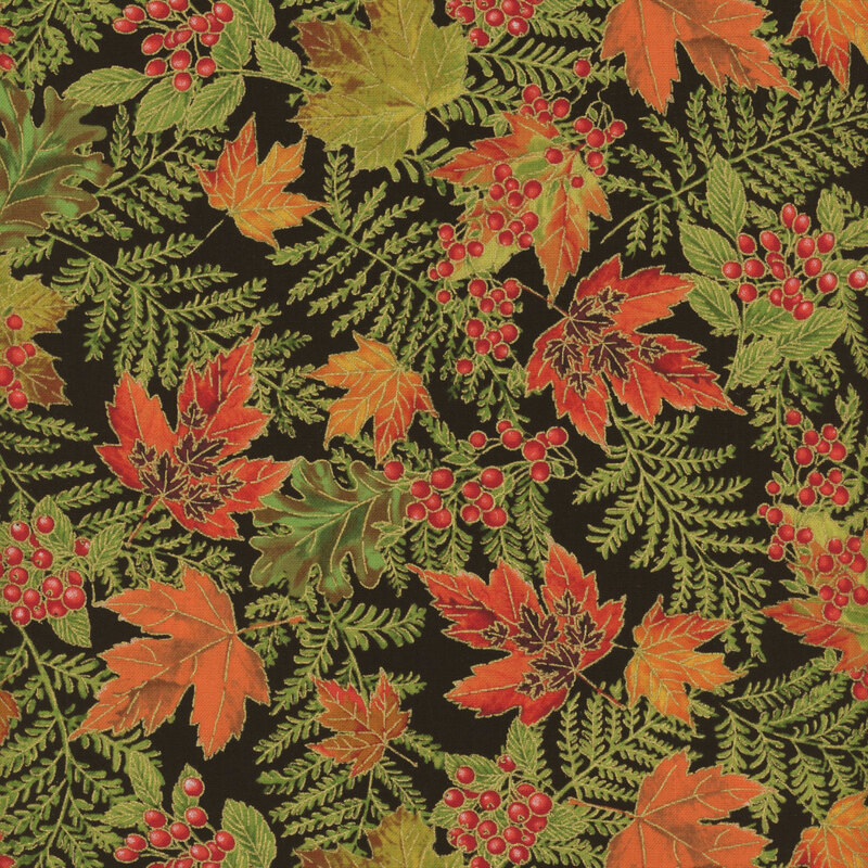 tossed orange fall leaves and fern leaves on a black background.