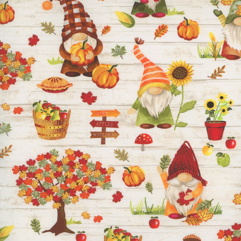 Scan of fabric featuring gnomes picking apples and pumpkins on a cream background
