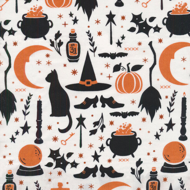 White fabric with silhouettes in black and orange of Halloween motifs like cats, candlesticks, brooms, a crescent moon, crystal ball, etc.