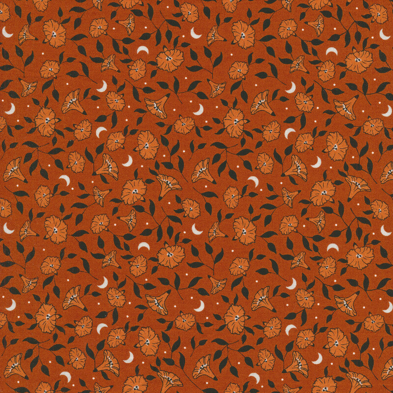Dark burnt orange fabric with tossed orange pumpkin flowers with black leaves and tiny white crescent moons between them
