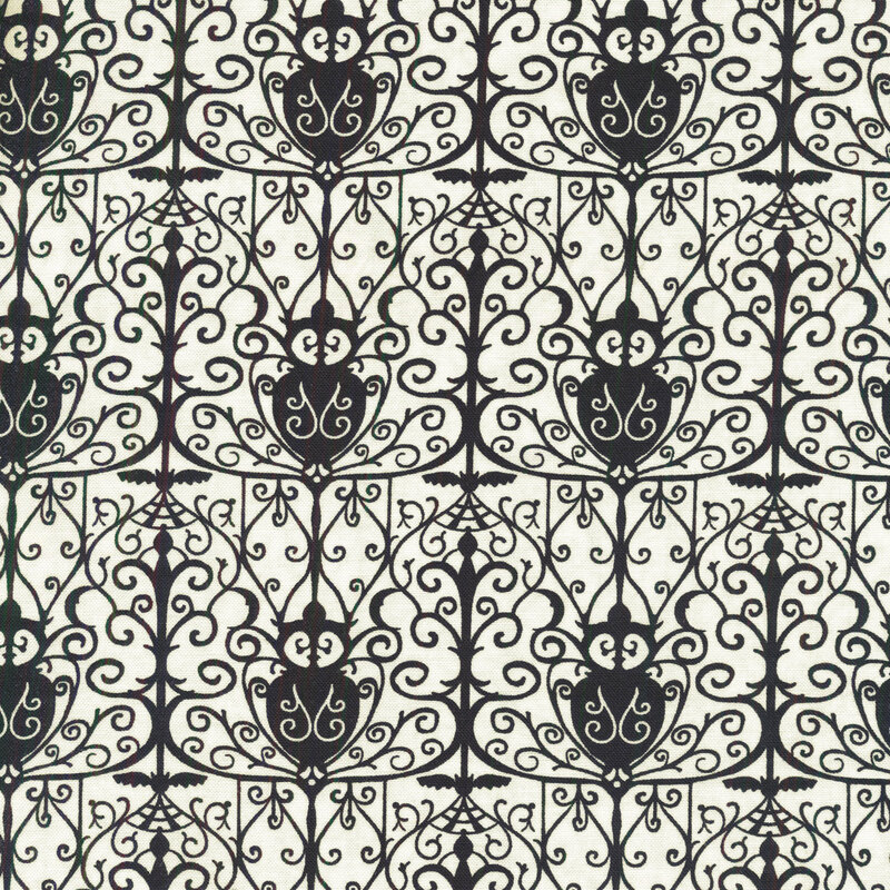 White fabric with a black repeated wrought iron gate design silhouetted in the foreground