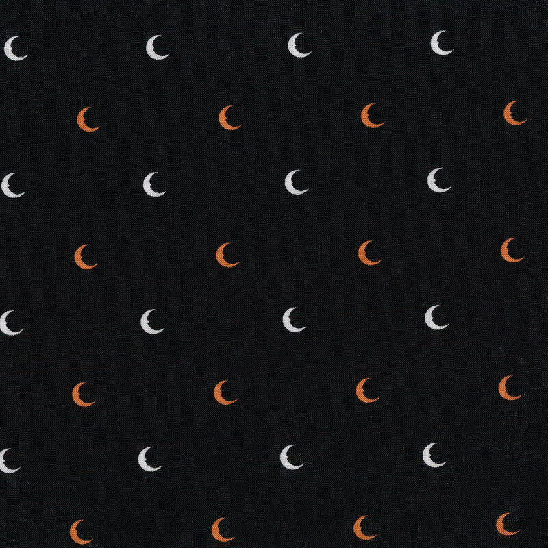 Black fabric with orange and white crescent moons evenly spaced all over