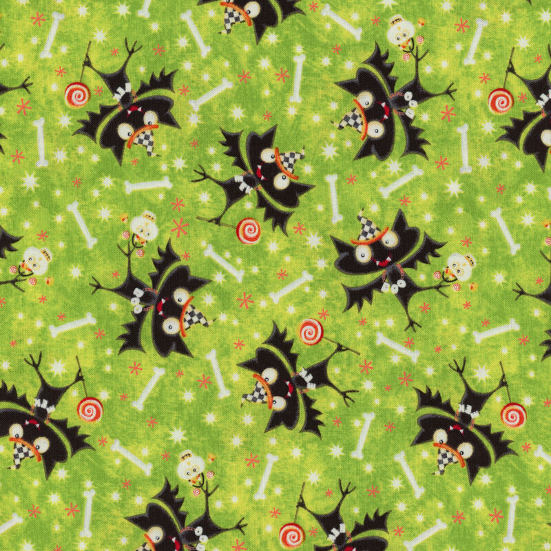 Bright green fabric with cartoon bats wearing party hats holding skull candy buckets and lollipops with bones tossed all over