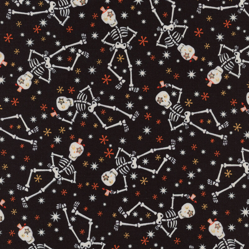 Black fabric with tossed skeletons wearing tiny hats and multicolored stars in between
