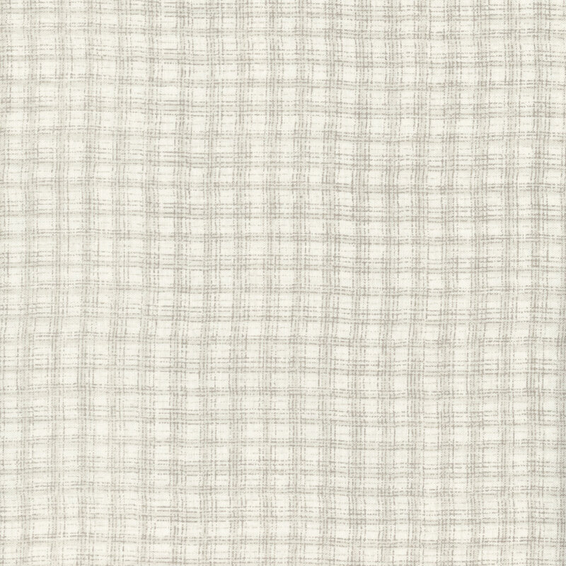 This fabric features a tonal beige plaid pattern