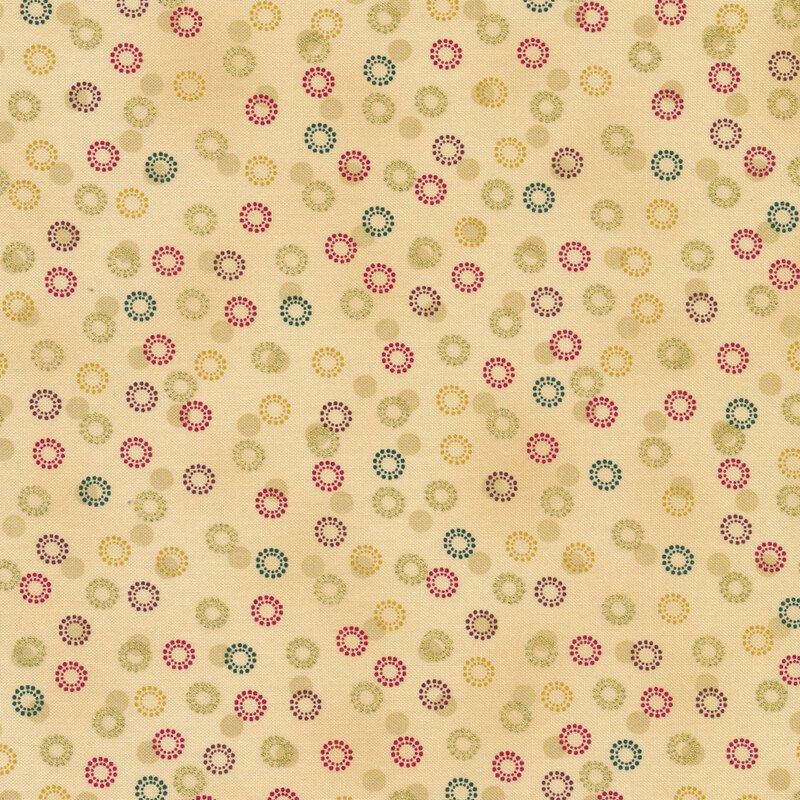 Light beige fabric with green, red, and gold circular snowflakes