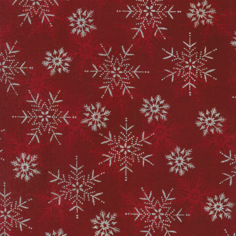  red mottled fabric red and silver metallic snowflakes all over