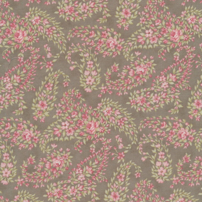 Gray fabric with a paisley pattern made up of pink flowers and green leaves