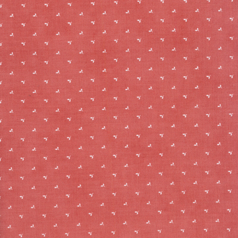Pink fabric with tiny white pairs of flower buds alternating in rows