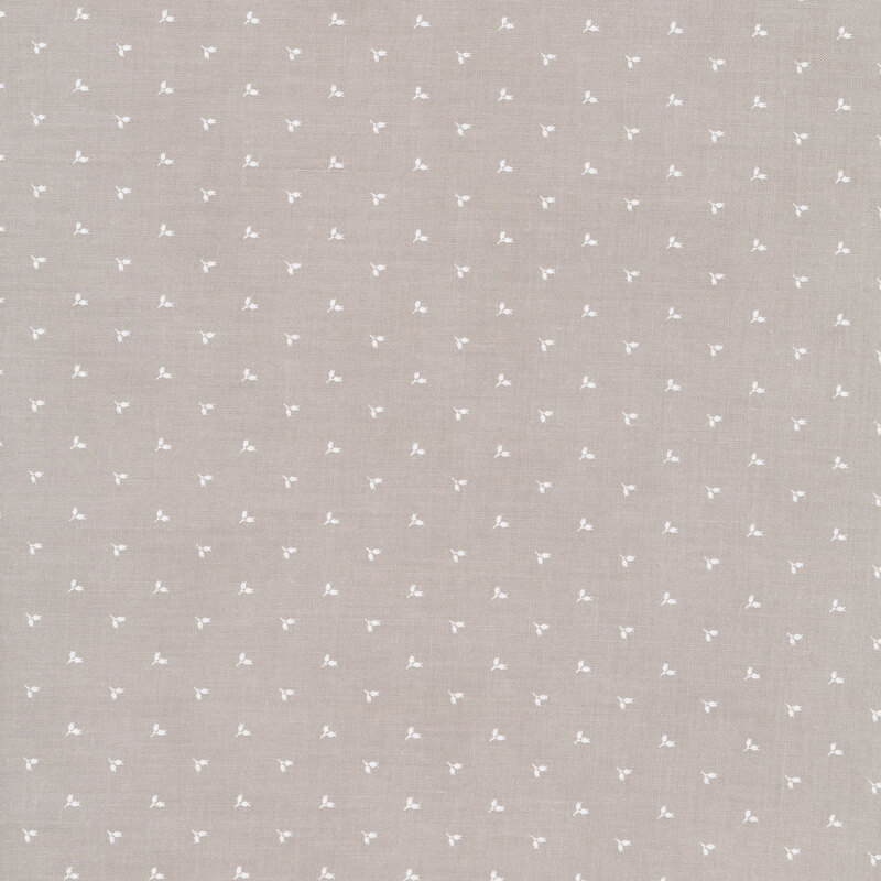 Gray fabric with tiny white pairs of flower buds alternating in rows