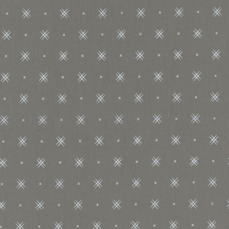 Gray fabric with rows of small white x's and double criss-cross patterns