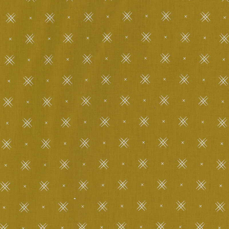 yellow-green fabric with rows of small white x's and double criss-cross patterns