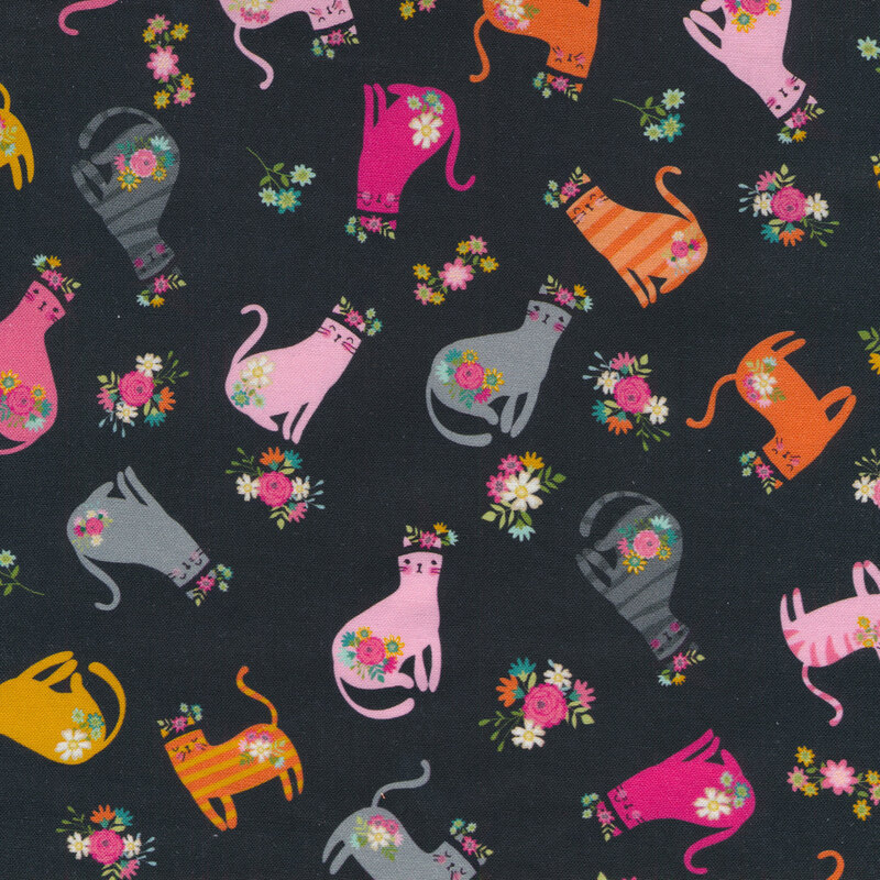 Black fabric with a variety of tossed colorful cats wearing witch hats.