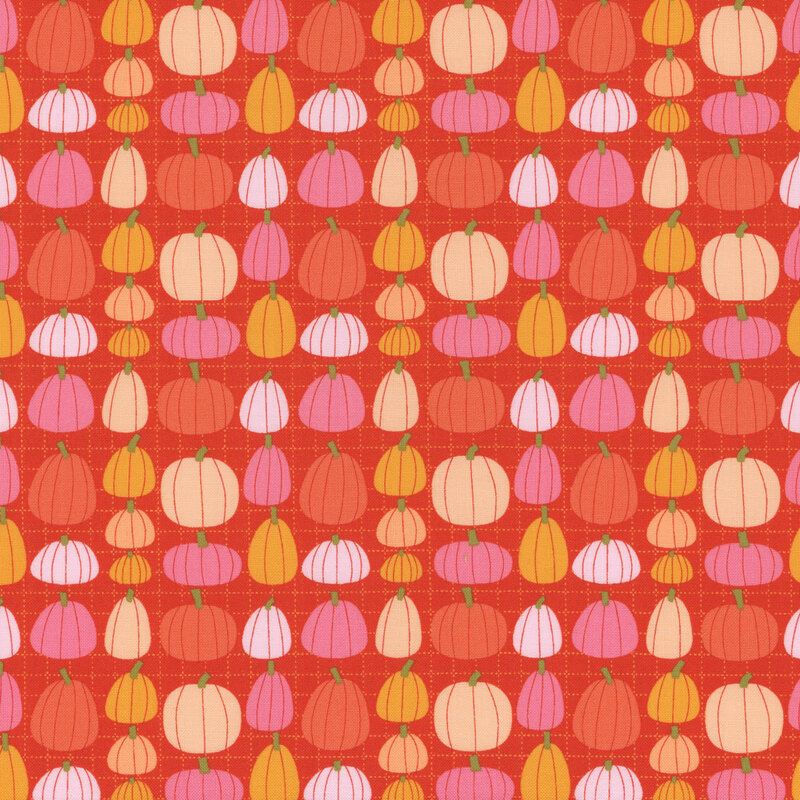 Burnt orange fabric covered in colorful pumpkins