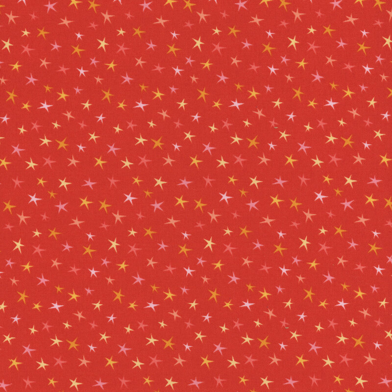 Burnt orange fabric with colorful stars all over