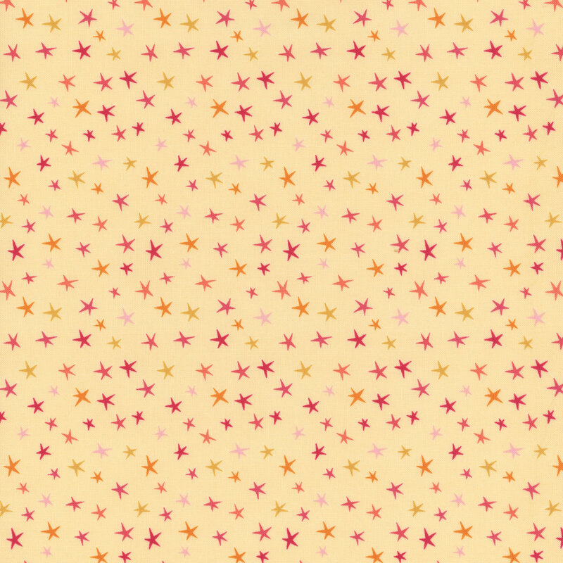Pale yellow fabric with colorful stars all over