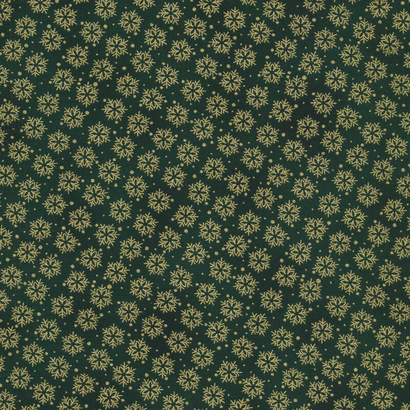 Green mottled fabric with gold metallic snowflakes all over