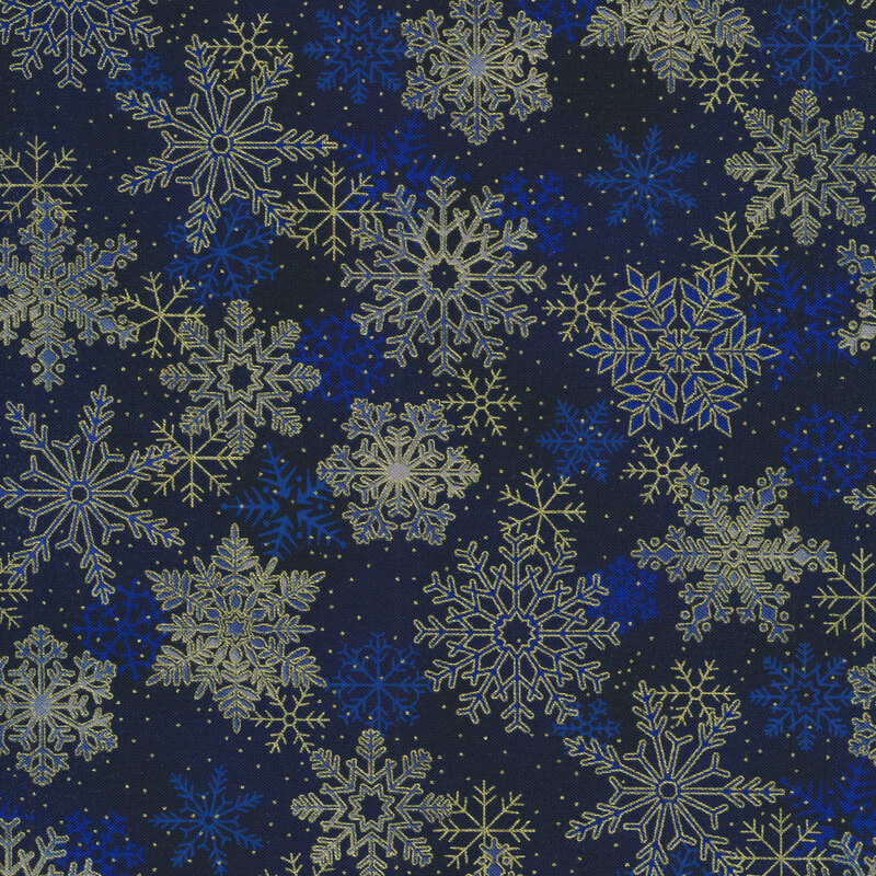 Dark blue mottled fabric with large gold metallic snowflakes all over