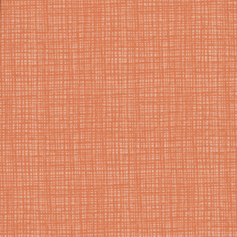 A tonal coral fabric with a textured background
