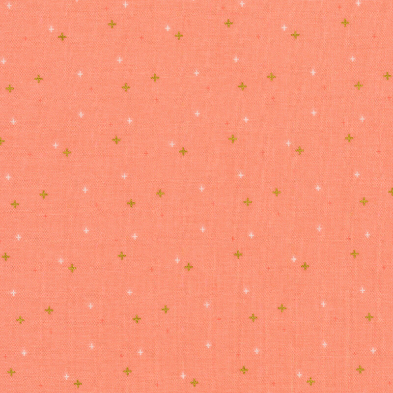 peach fabric with gold and white plus signs/crossed lines scattered all over.
