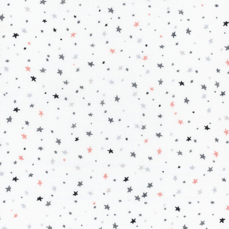 White fabric with scattered black, gray, and orange stars all over