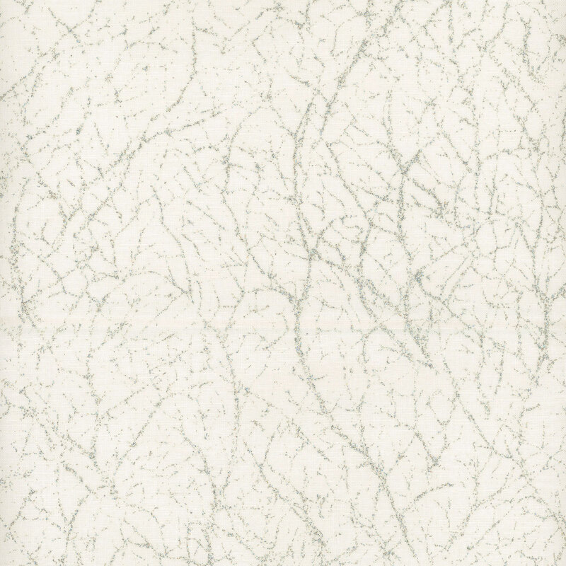 White mottled fabric with silver glitter in a pattern that mimics cracks or webs