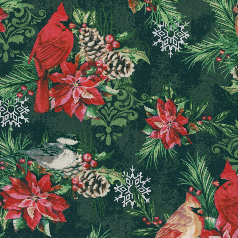 Fabric featuring red cardinal birds with poinsettias and pine on a green background