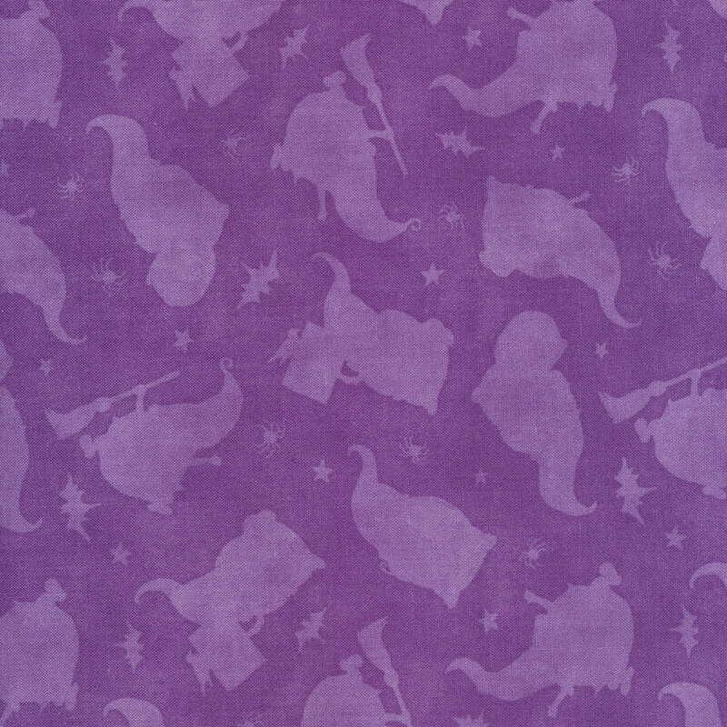 Tonal purple fabric with silhouettes of gnome witches and stars