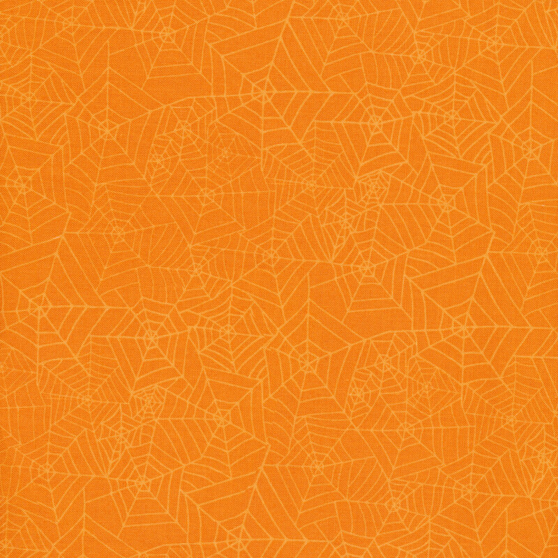 Bright orange fabric with light orange tonal spiderwebs all over