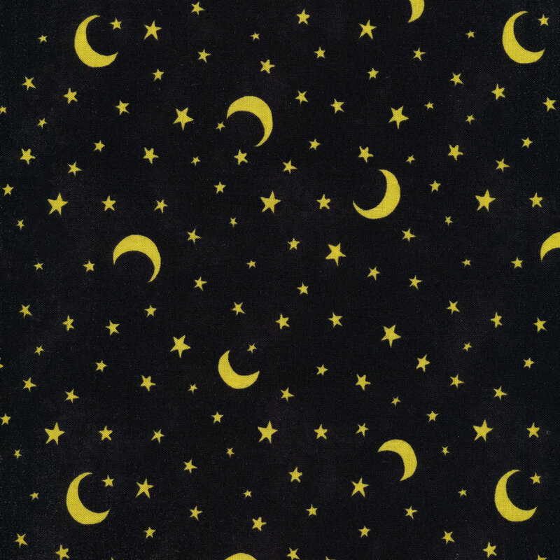 Black fabric with yellow stars and crescent moons all over