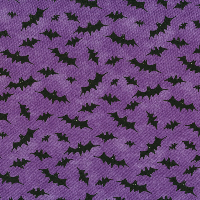 Purple fabric with tossed black bats all over