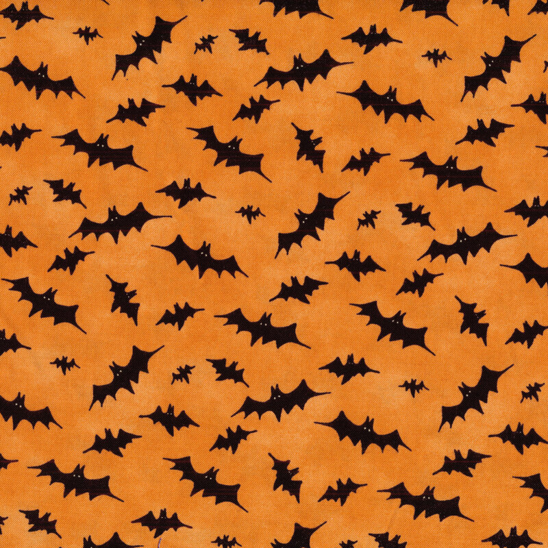 Orange fabric with tossed black bats all over